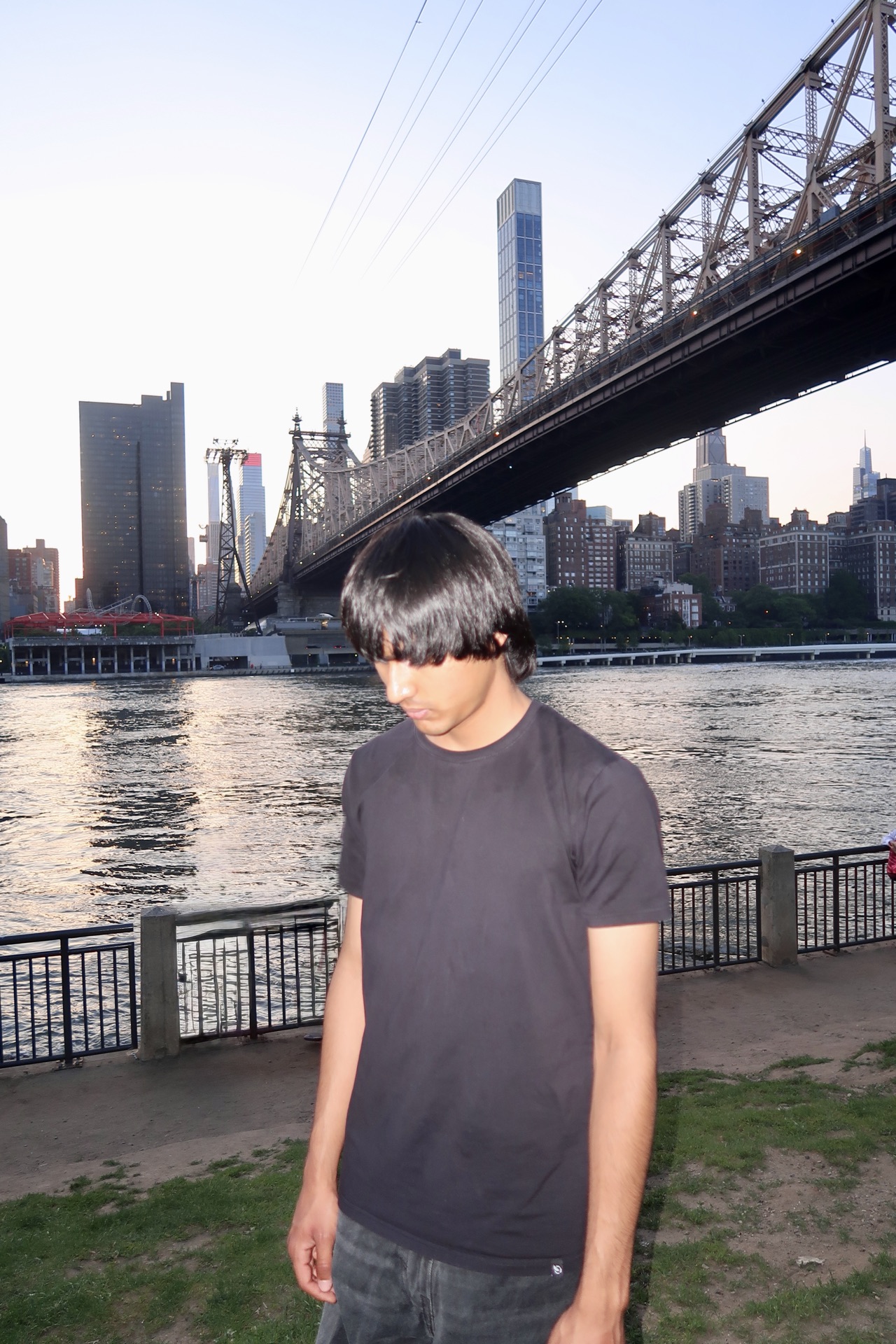 Arshroop Saini by the bridge on the waterfront